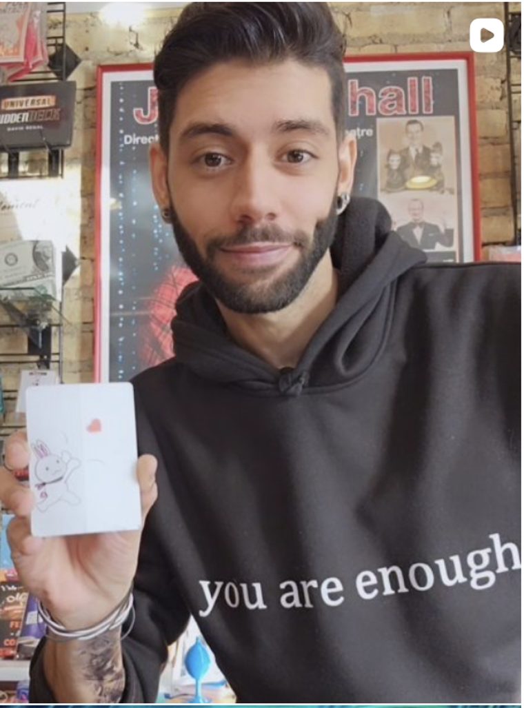 Jake Bozsman holding a playing card